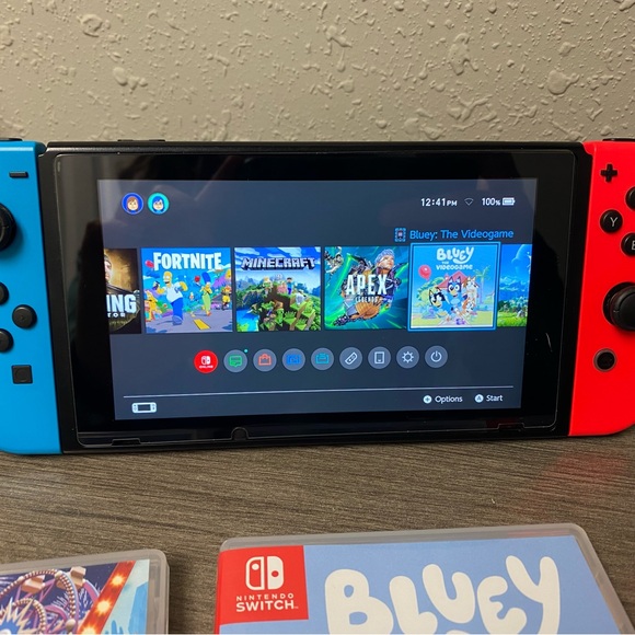 Nintendo Switch with Blue and Red Joy-Con and Game Bundle - Picture 2 of 9